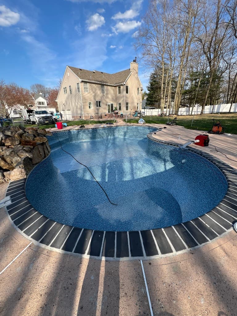 After: patterned vinyl liner set to shape, trims in, pool ready for fill and chemistry.