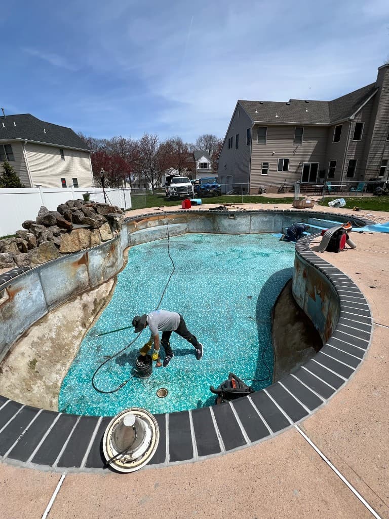 During: shell prepped and materials staged while we corrected structure before the new liner.